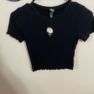 Black top with embroidered flower